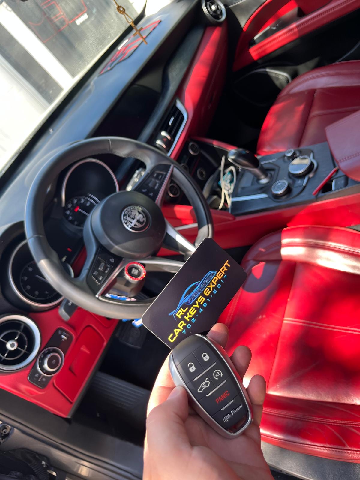 Alfa Romeo key fob at the steering wheel